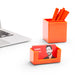 "Modern workplace with laptop, orange stationary holders and business card holder on white background (Orange)