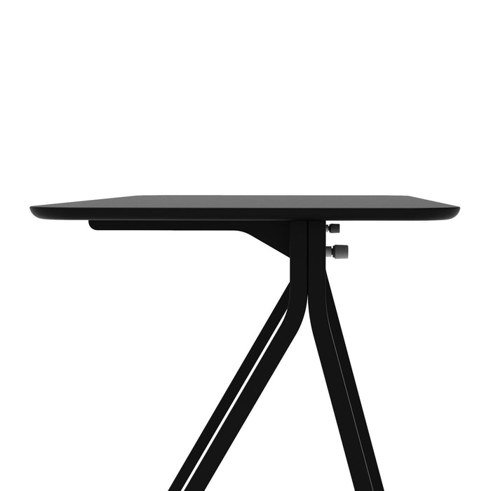 Black modern minimalist table with a unique triangular leg design on a white background. (Black)