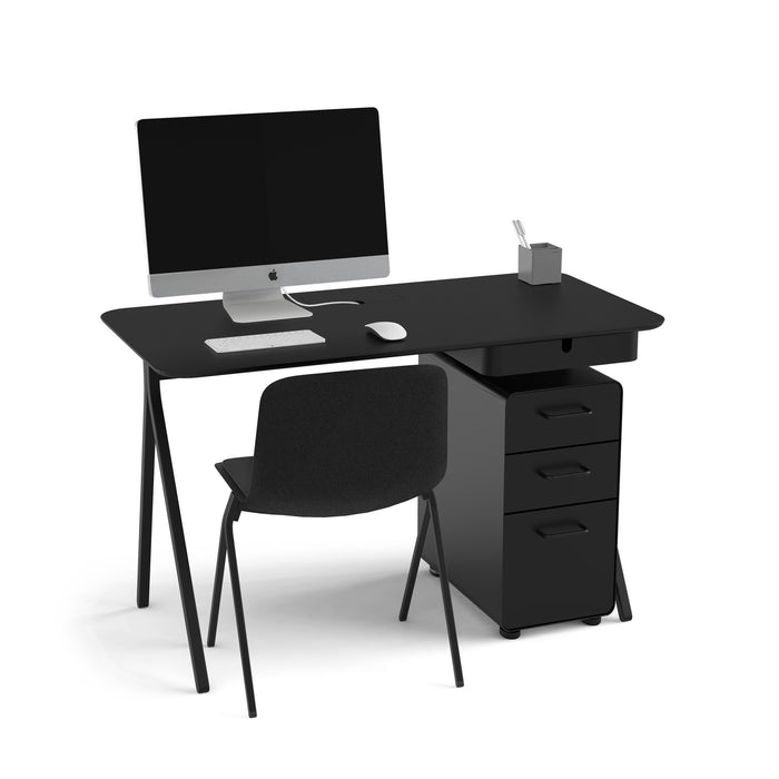 Modern black office desk with computer, chair, and stationery isolated on white background. (Black)