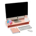 "Modern workspace with Apple iMac on pink stand, keyboard, mouse, notebook (Blush)