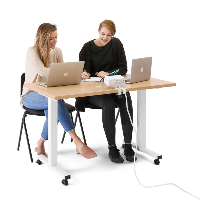 Two professionals working together at a modern office desk with laptops. (Natural Oak-47&quot;)