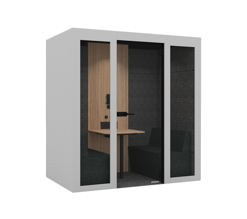 Modern office phone booth for 2 with wooden desk and green seating on gray carpet. (White)