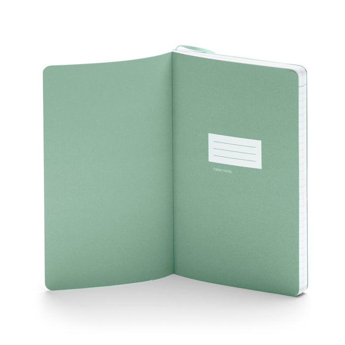 Green notebook open with blank pages and take note text on white background. (Sage)