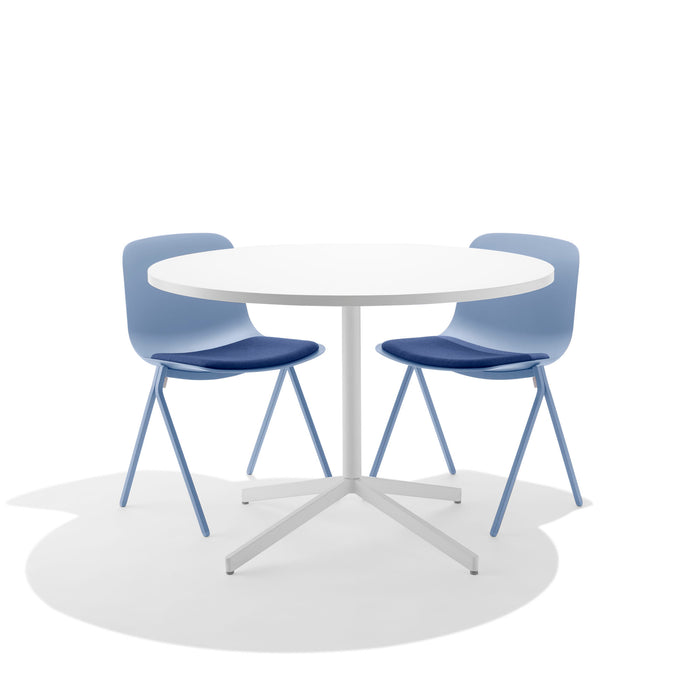 Modern white round table with two blue chairs on a white background (Sky)