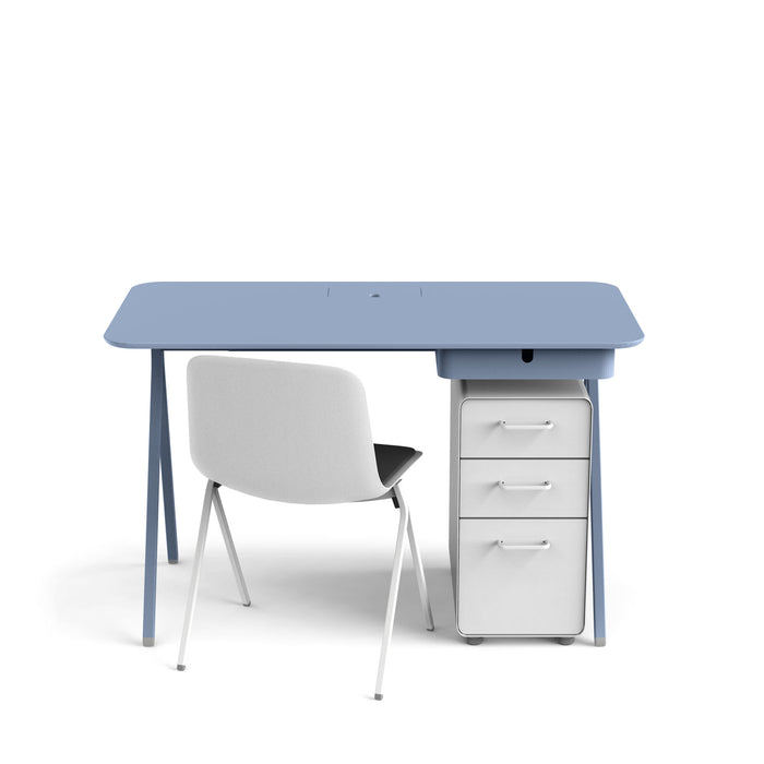 Modern blue office desk with white drawers and a gray chair on a white background. (Sky)