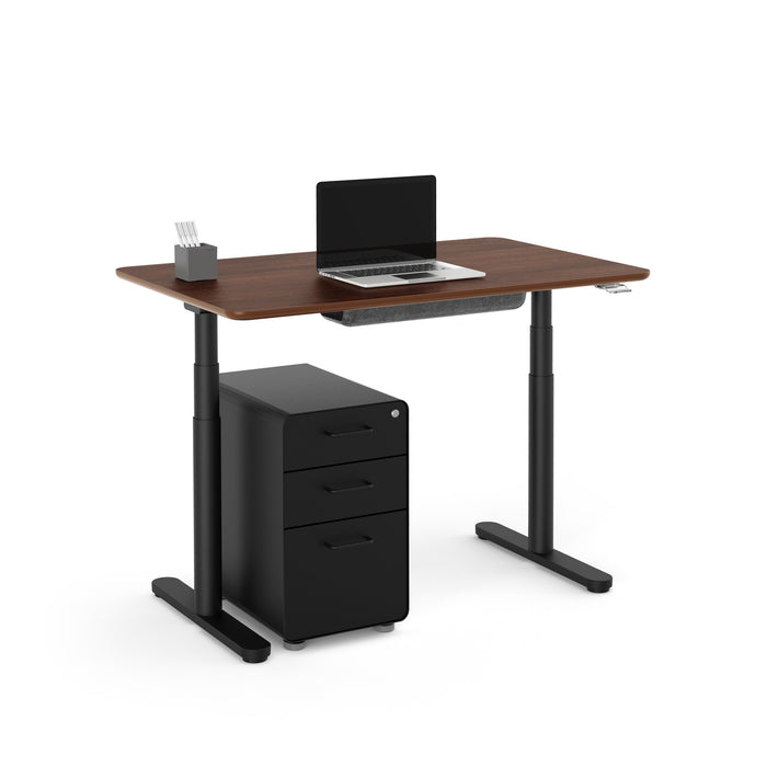 Modern standing desk with laptop and black file cabinet on white background. (Walnut-48&quot;)