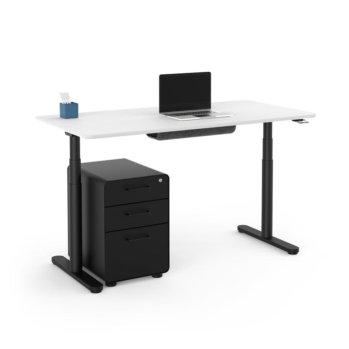 Modern standing desk with adjustable height, laptop, and black filing cabinet on white background. (White-60&quot;)