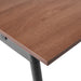 Close-up view of a modern standing desk highlighting the wood grain surface and sturdy metal frame. (Walnut)