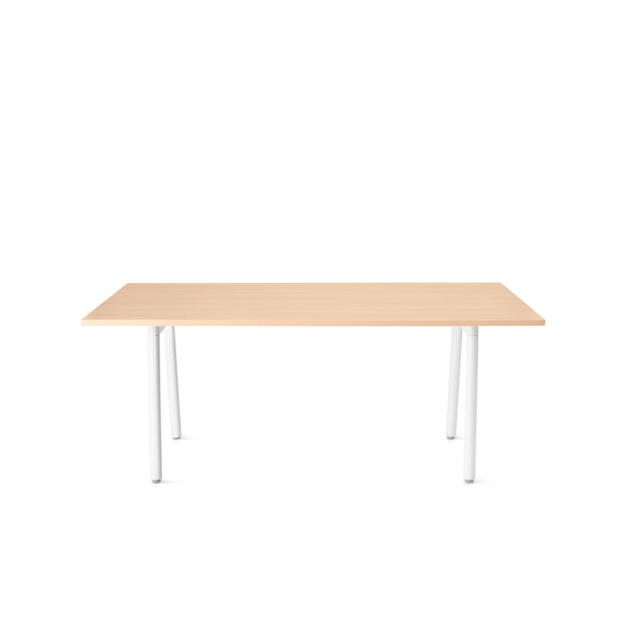 Modern minimalist wooden desk with white legs on a white background. (Natural Oak)