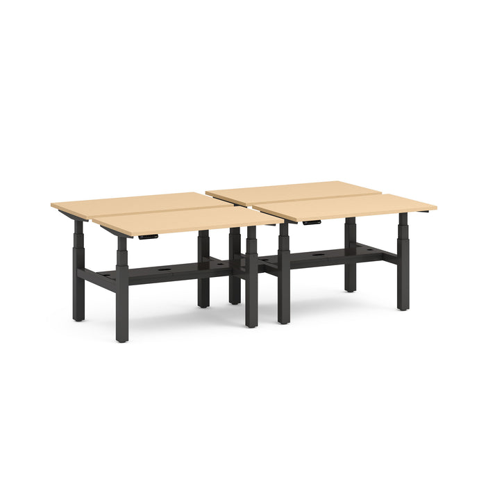 Adjustable height dual-desk with tan tabletops and black frames on a white background. (Natural Oak-47&quot;)