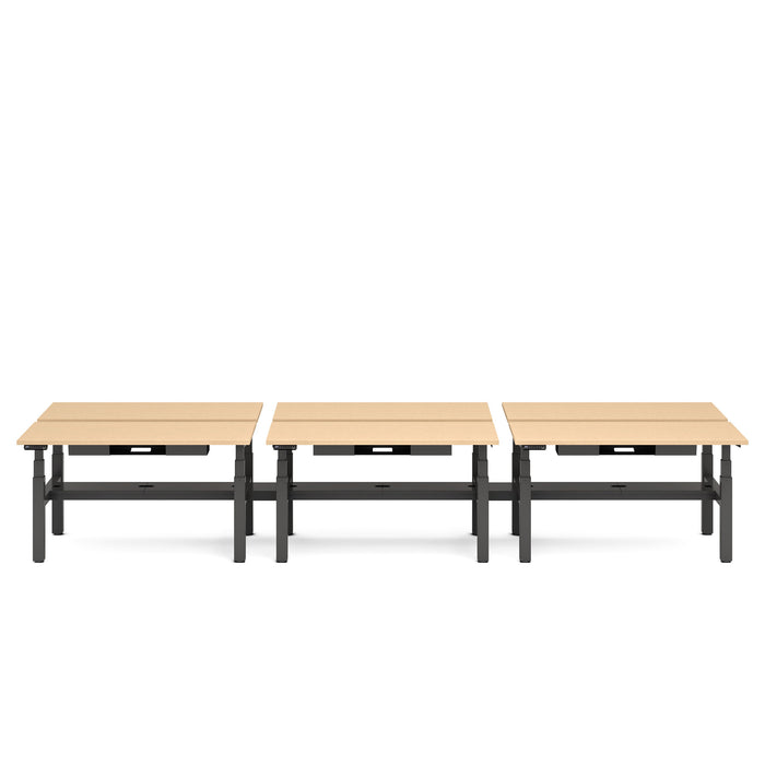 Three beige adjustable-height desks in a row on a white background. (Natural Oak-57&quot;)
