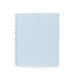 Blue spiral notebook with dotted pattern cover on white background. (Sky)