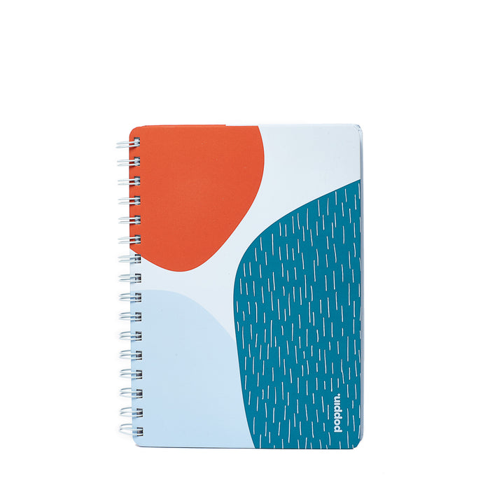 "Blue and orange abstract design spiral notebook on white background." (Sky)
