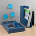 Organized desk with stationary, smartphone, magazines, and blue sticky notes on wall (Slate Blue)
