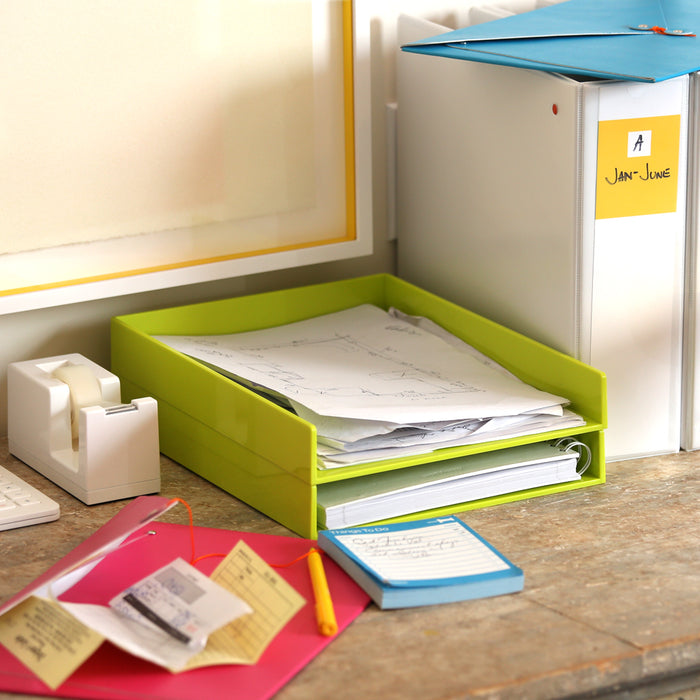 "Organized office desk with colorful trays, papers, and stationery on a (Lime Green)