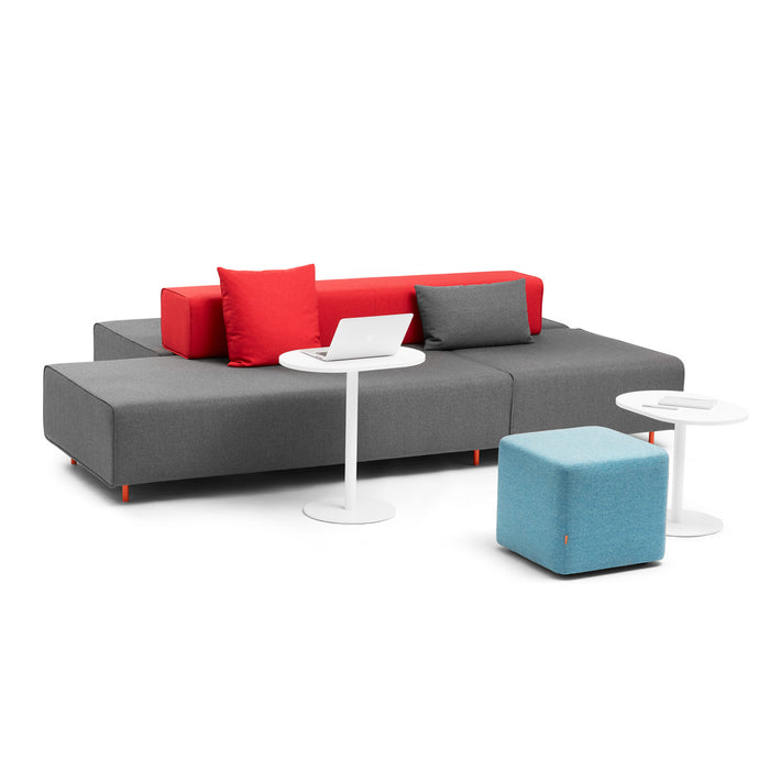 Modern gray sofa with red pillows, blue ottoman and white side tables on white (25&quot;)