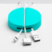 Blue cable organizer with USB, Lightning, and laptop charger cables on white surface. (White)(Aqua)