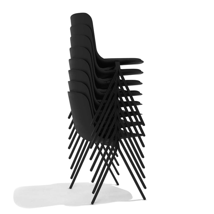 Stack of black modern design chairs on a white background. (Black)
