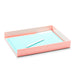 Coral stationary tray with blue paper and white pen on white background (Blush)