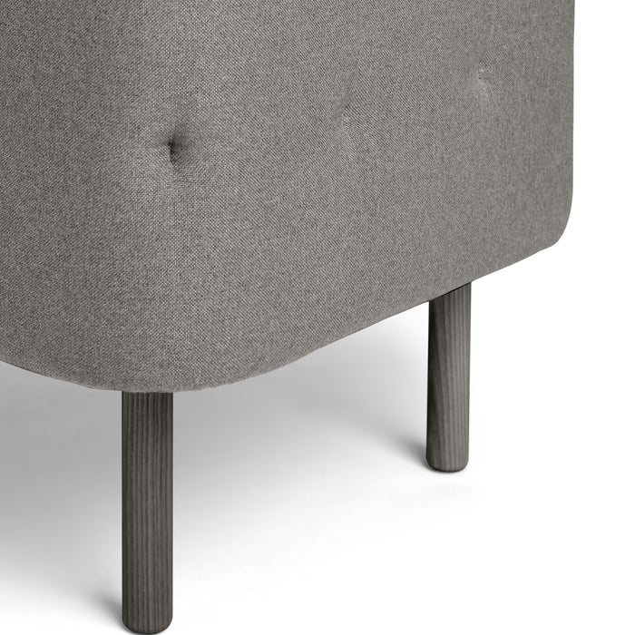 Close-up of a grey upholstered chair with wooden legs on a white background. (Brick-Gray)(Dark Blue-Gray)(Dark Gray-Gray)(Gray-Gray)