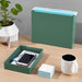 Modern desk organization with green file holder, smartphone in tray, and black coffee mug (Sage)