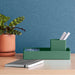 Modern green desk organizer, pens, and notebook on a work desk with a p (Sage)