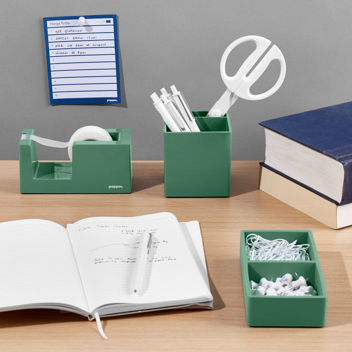 Organized desk with stationery holders, notebooks, and office supplies on wooden surface (Sage)
