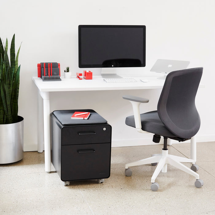Modern home office workspace with computer, desk chair, and decorative plants. (Black-Black)