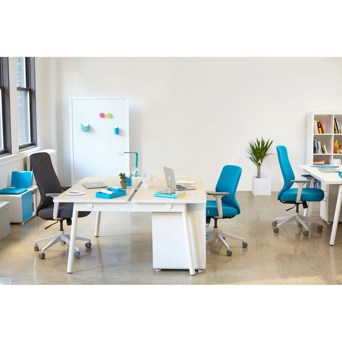 Modern office workspace with clean white desks, blue chairs, and a potted plant 