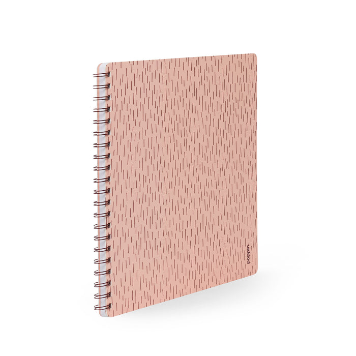 Pink spiral notebook with abstract design isolated on white background. (Blush)