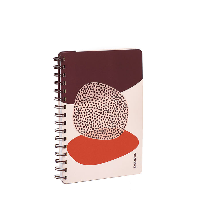 Modern spiral notebook with abstract cover design on white background. (Blush)