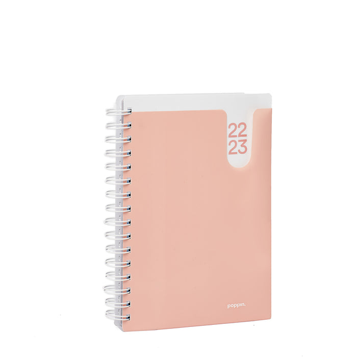 Peach-colored 2022-2023 planner with spiral binding on a white (Blush)