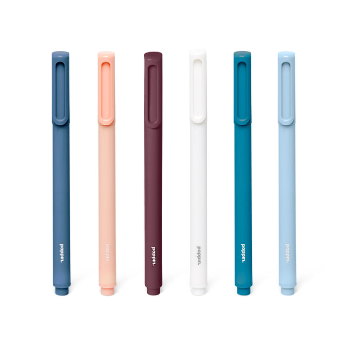 Variety of colorful stylus pens by Wacom lined up against a white background. 