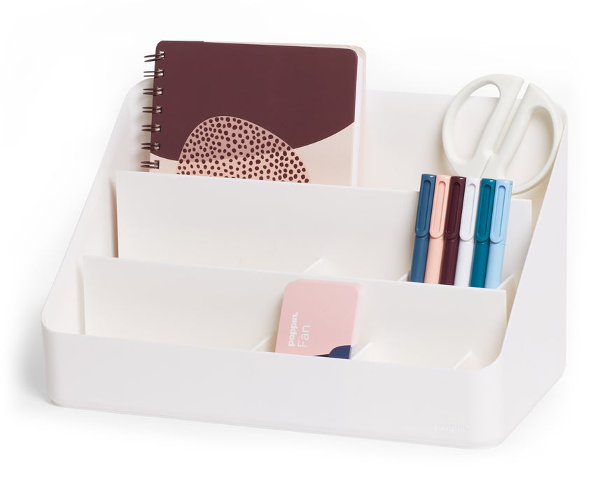 Desk organizer with notebooks, pens, and scissors on a white background. 