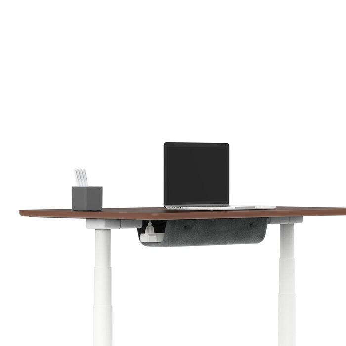 Modern office desk with laptop, notebook, and pen on white background. 