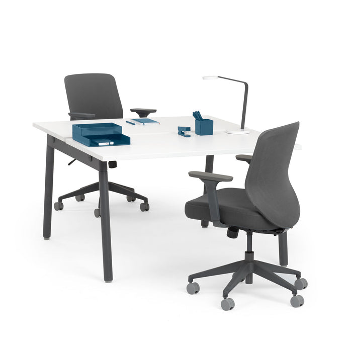 Modern office desk setup with ergonomic chair, lamp, and blue stationery on white background. (White-57&quot;)