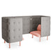 Modern grey upholstered privacy booth with pink cushions and wooden legs against a white background. (Blush-Gray)