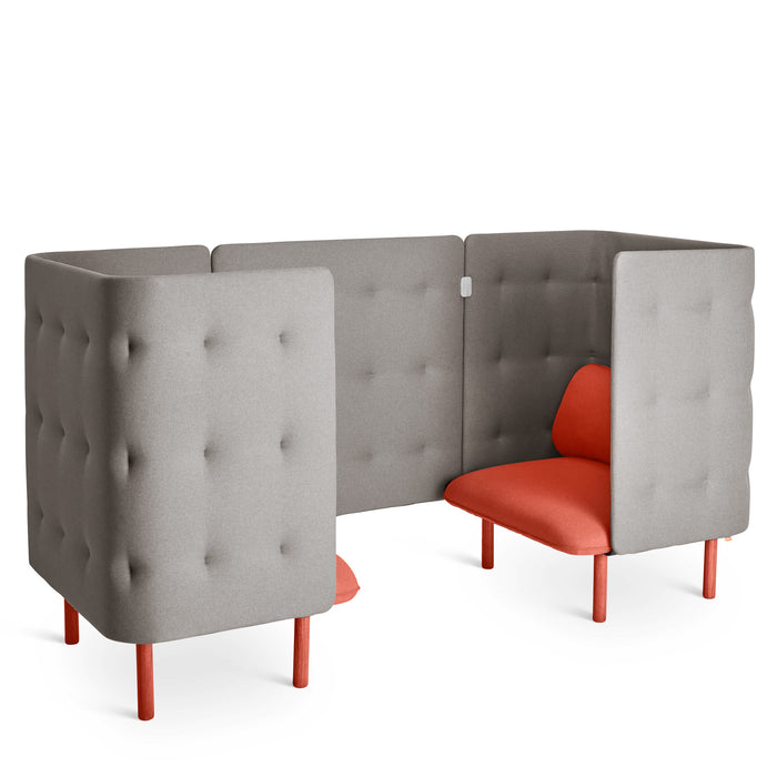 L-shaped gray tufted privacy booth with red cushions on a white background. (Brick-Gray)