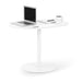 Modern white standing desk with laptop, notebook, pen, and coffee mug on white background. 