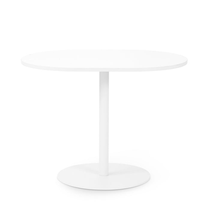 White round pedestal table on a white background. 