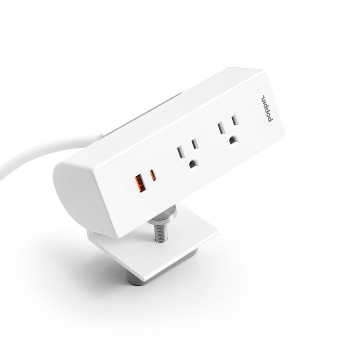 White multi-port USB charger on a stand against a white background. 