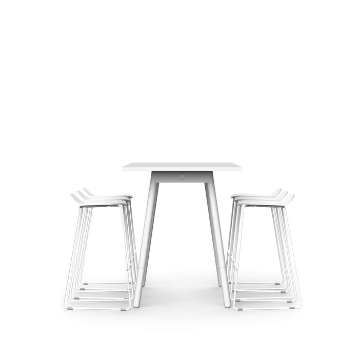 Modern white desk with stackable metal chairs on white background. (White)