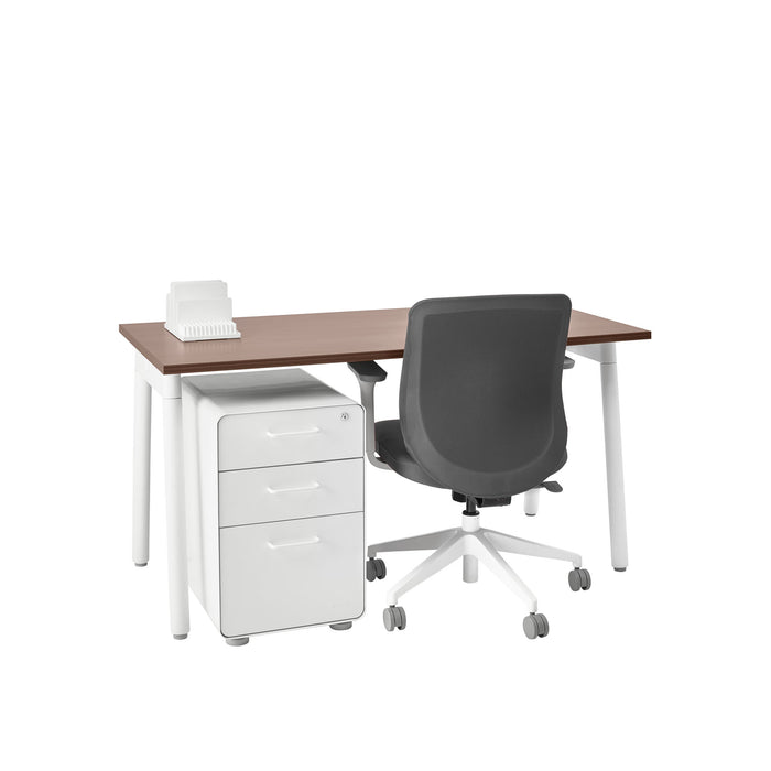 Modern office workspace with a brown desk, white filing cabinet, and black rolling chair. (Walnut-57")