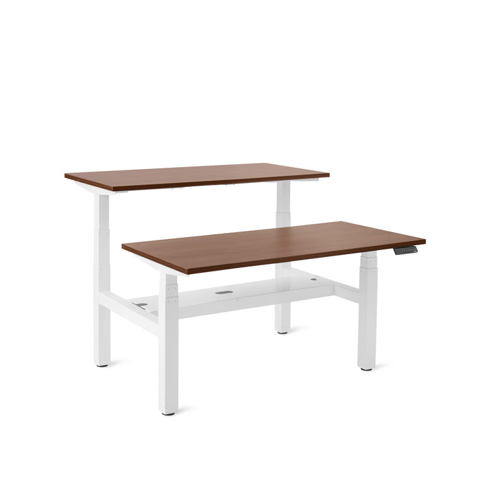Adjustable height modern desks with white legs and wooden tabletops on white background. (Walnut-47&quot;)