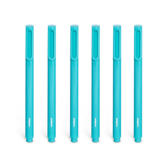 Set of six blue markers with caps on against a white background. 