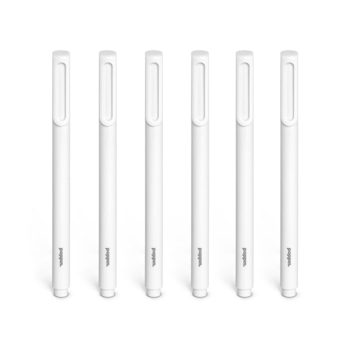 White digital stylus pens in a row against a white background. 
