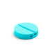 Aqua blue round silicone pill case on a white background. (Aqua)