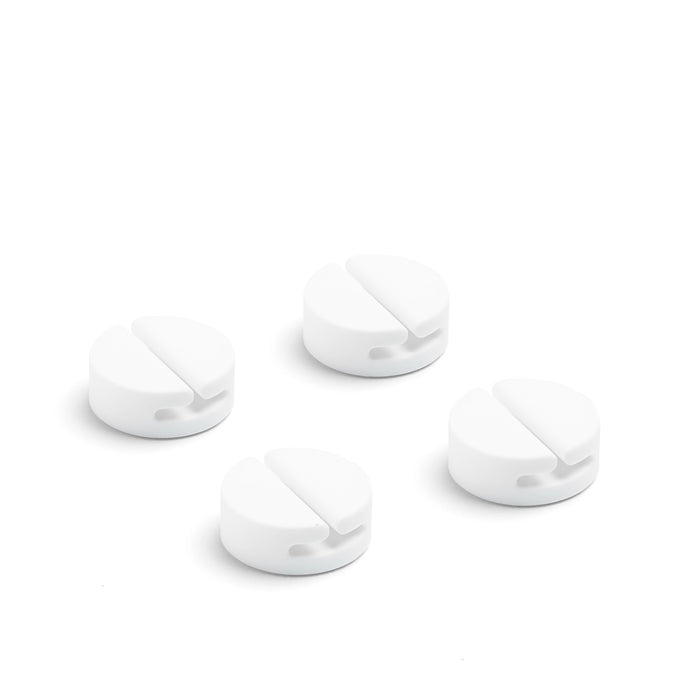 Four white adhesive cable clips on a white background. (White)