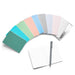 "Color swatches with various shades, notebook, and pen on white background for creative project planning." 