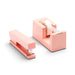 Pink stapler and tape dispenser on white background (Blush)